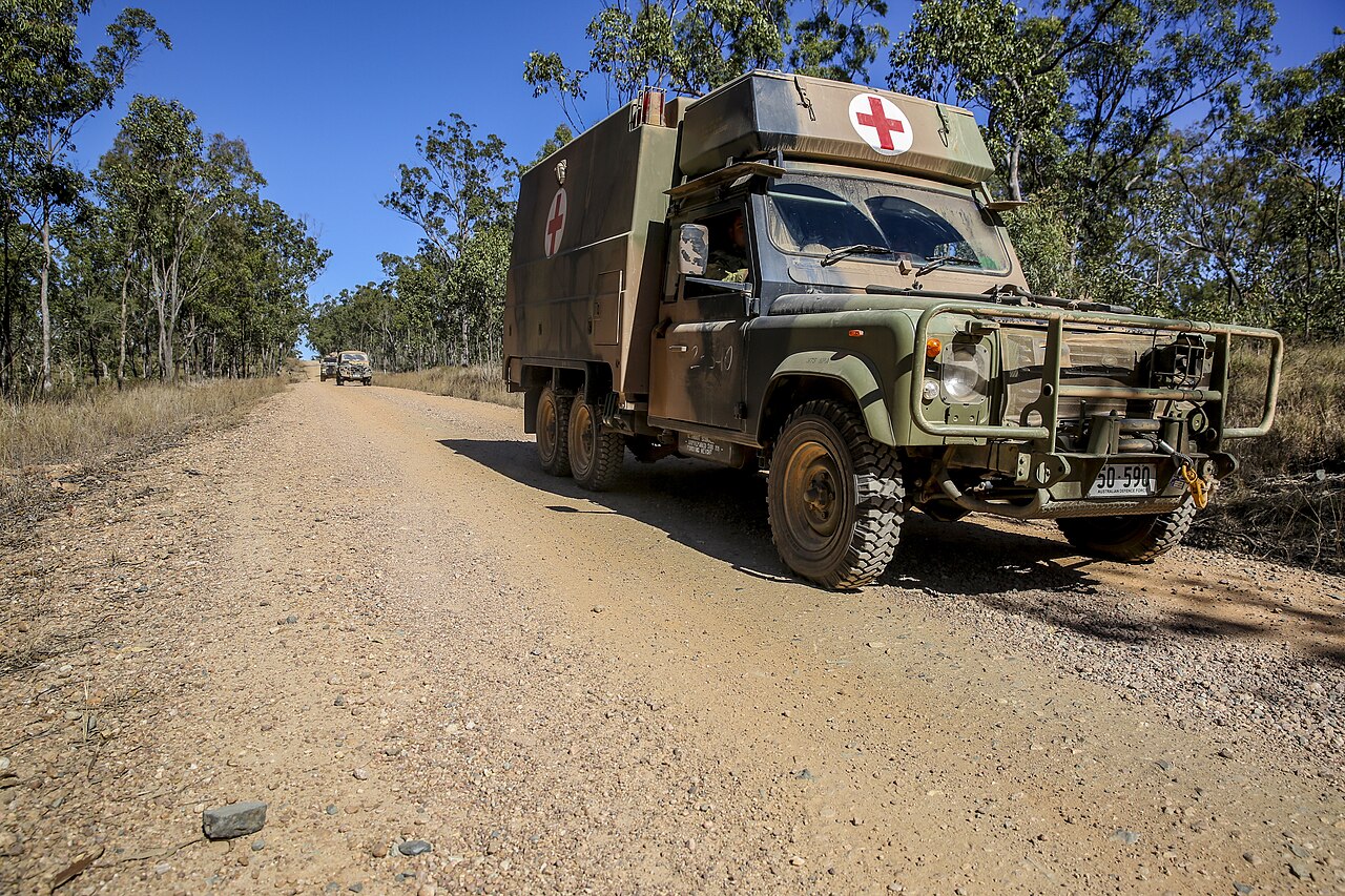 A Perentie 6x6 ambulance of the Australian Army on Exercise Hamel, July 2014 — the twin-axle variant assembled at JRA's Moorebank plant from 1989.