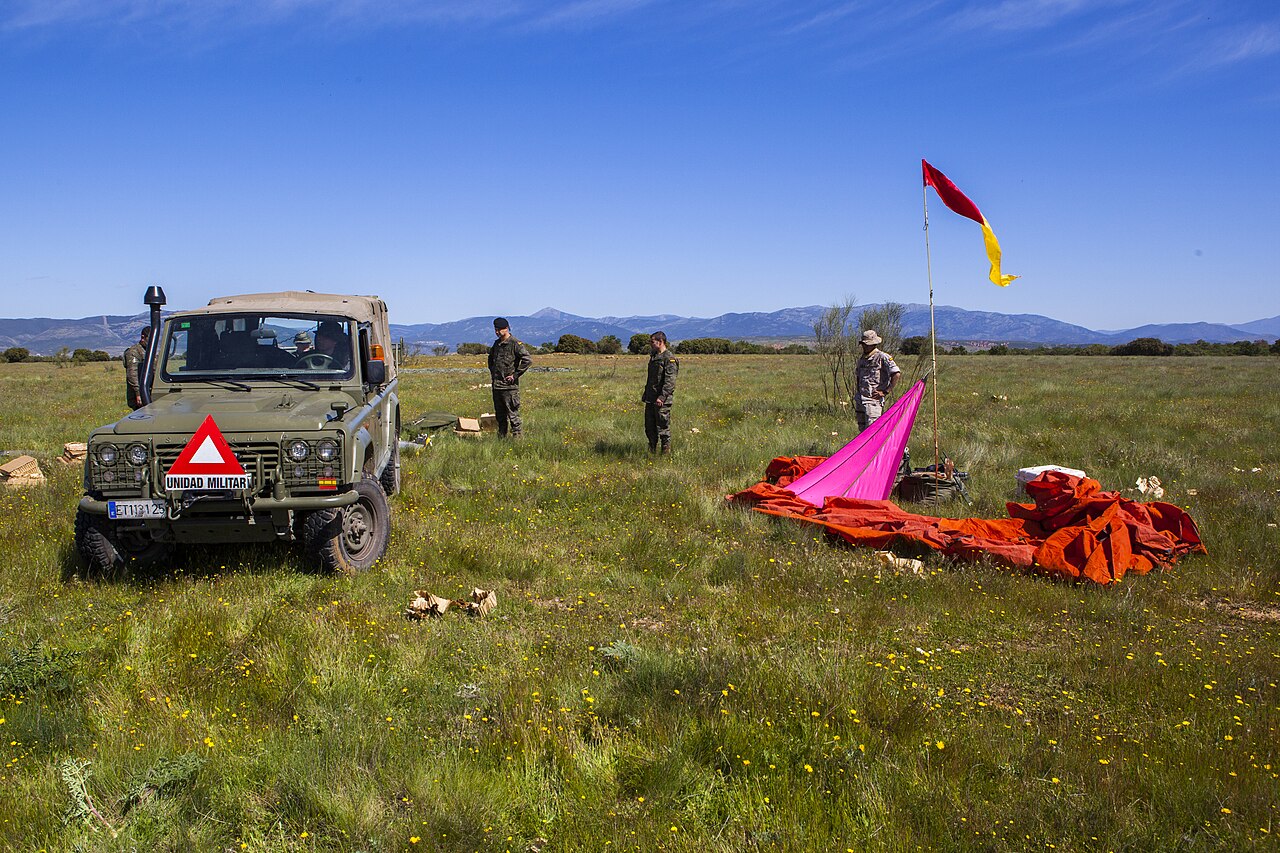 Soldiers of the Spanish Brigada Paracaidista recover a soft-top Aníbal (ET 113125) beside its parachutes after an airborne cargo drop, Operation Skyfall - España, May 2015. Airborne rather than special-operations use