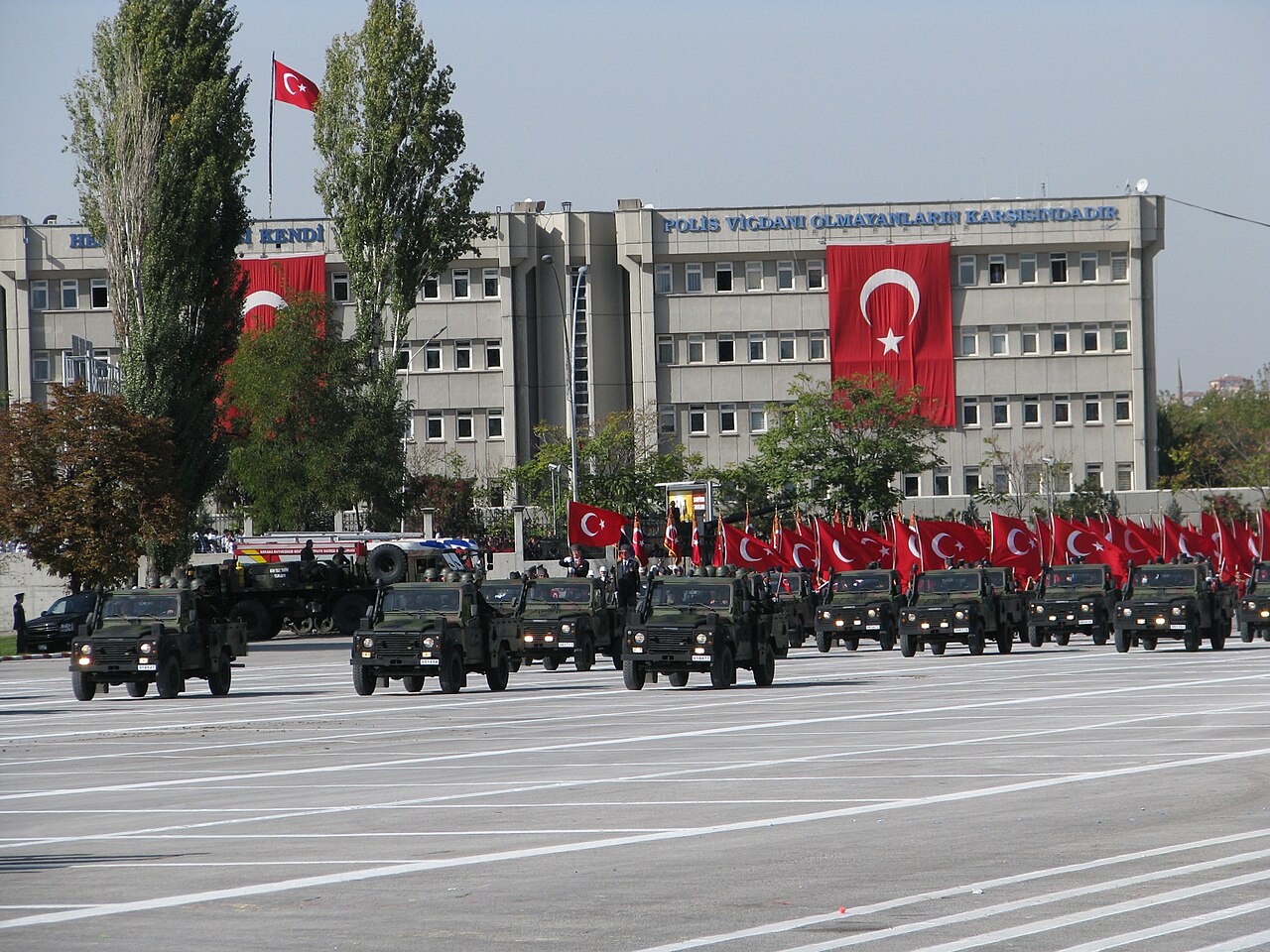 Columns of Otokar-assembled soft-top Defenders of the Turkish Armed Forces on parade, Republic Day, Ankara, 2012 — the M40A1 recoilless-rifle gunships were built on the same Otokar Defender 90 basis