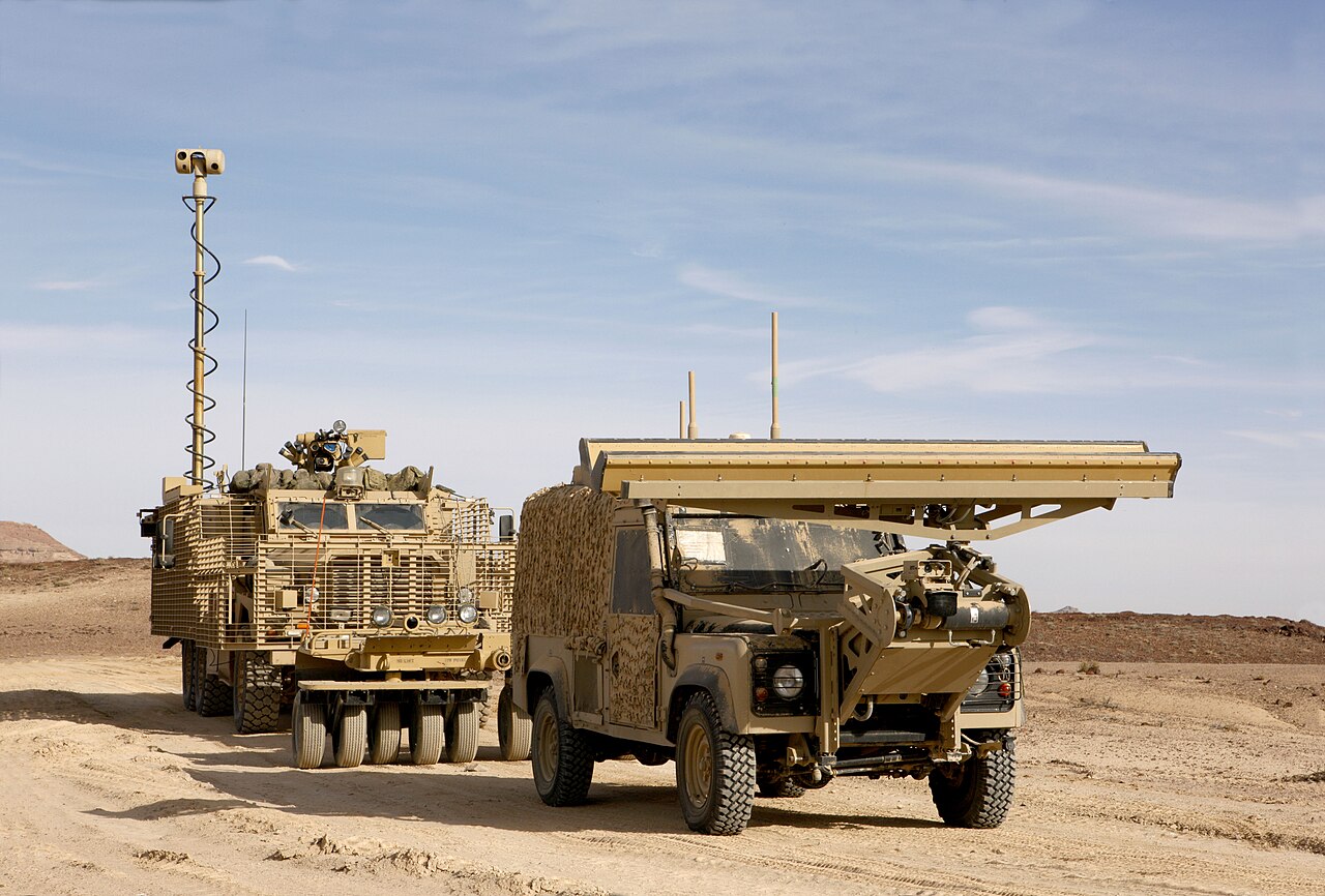 Panama remote-control Land Rover with its ground-penetrating radar boom leading a Mastiff fitted with Choker mine rollers, Exercise Pashtun Charge 5, Jordan, December 2012