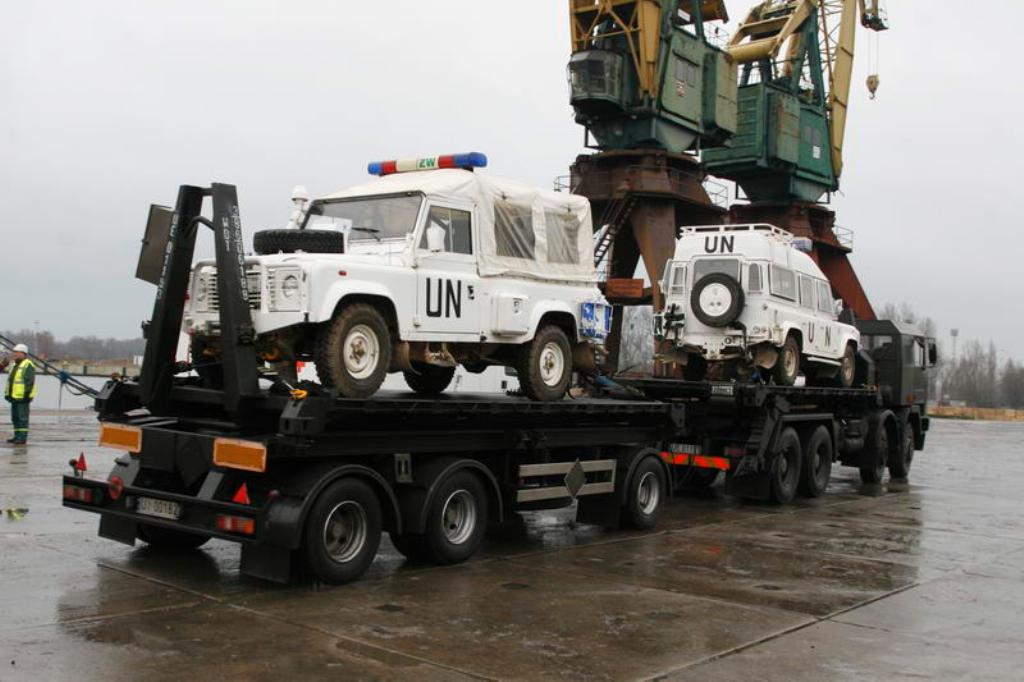 ZW Defender 110 soft top in UN white on the returning low-loader — the reference for this model; linked only.