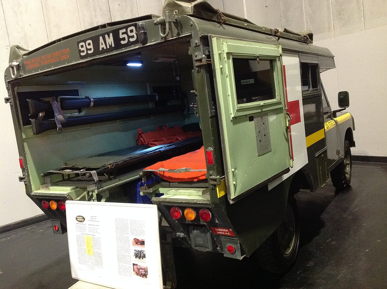 Marshall-bodied RAF ambulance 99 AM 59 displayed at the NEC Classic Car Show, 2019, rear doors open showing the stretcher bay