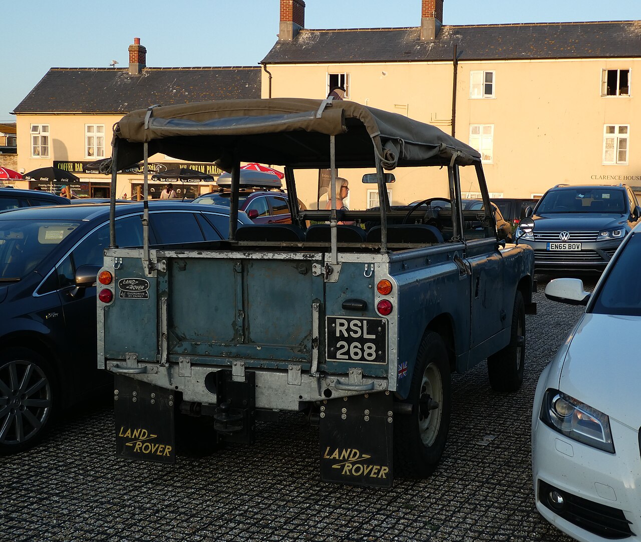 1959 Series II 88" soft top in Weymouth, England, its canvas tilt rolled up