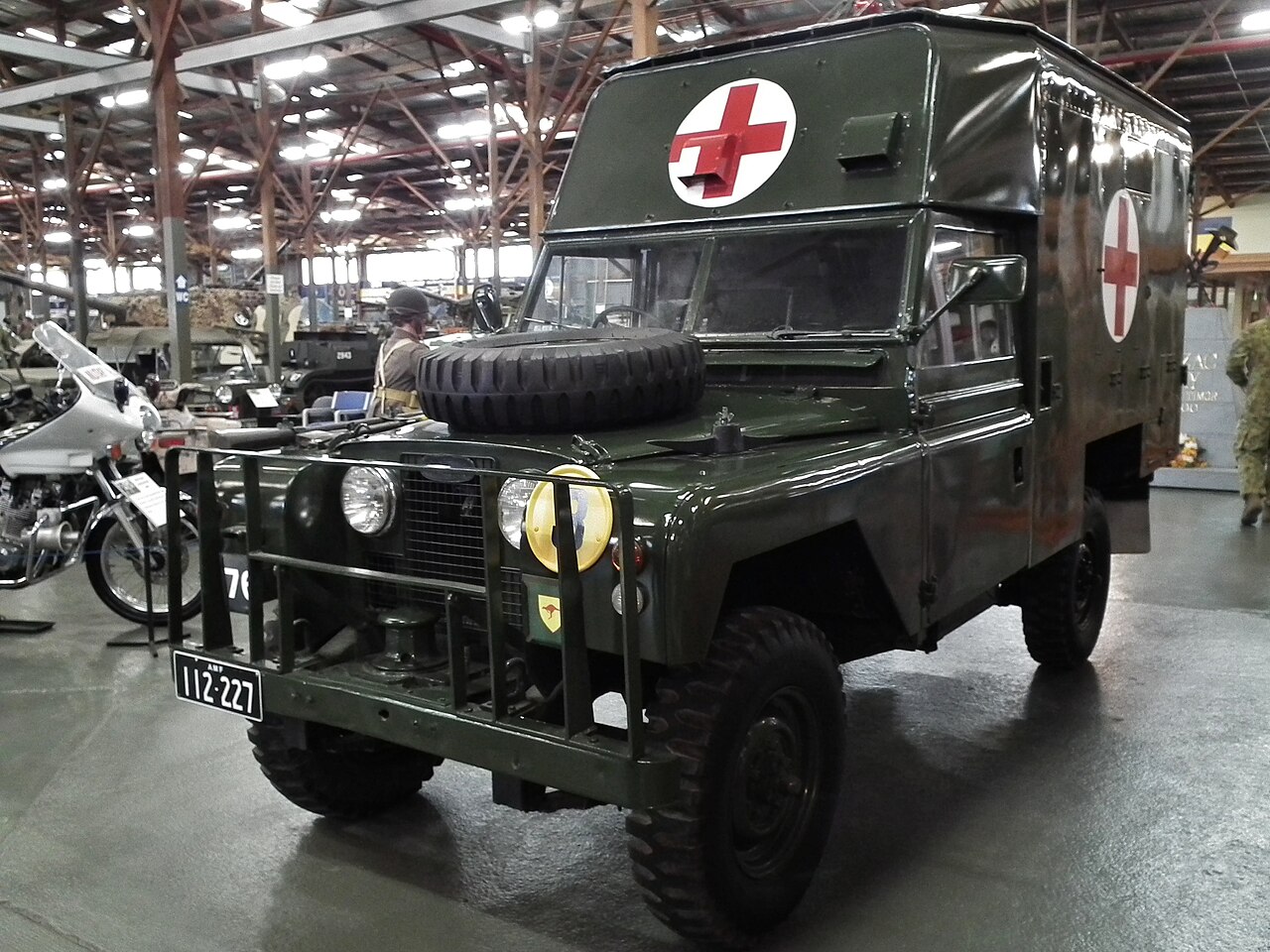 This is the vehicle the FWSF was NOT: the Australian Army's purpose-built 109-inch four-stretcher box ambulance (census 6362B), ARN 112-227, at the Army Museum Bandiana. The FWSF trucks borrowed this vehicle's C-section stretcher rails but kept the ordinary canvas-tilt cargo body. No freely licensed photograph of an FWSF truck is known.